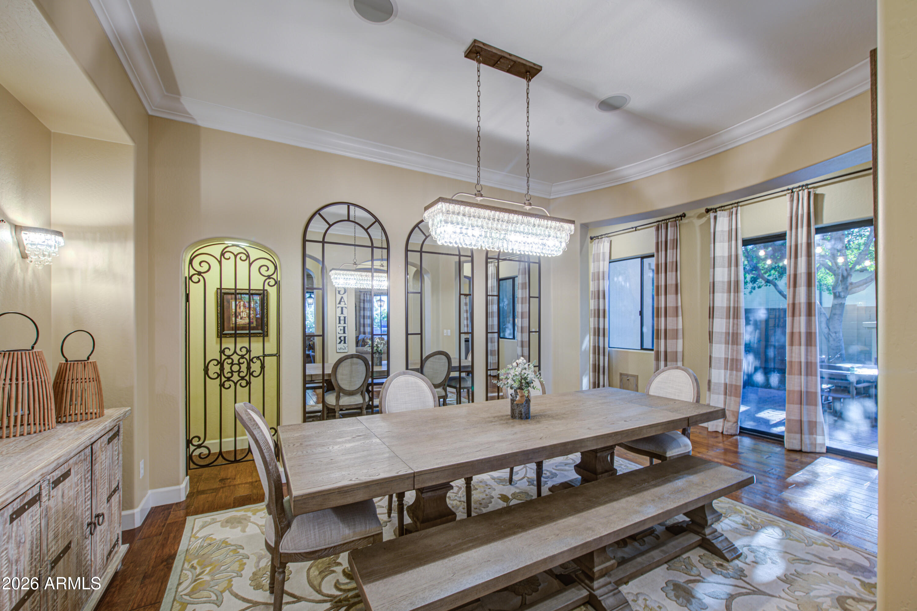 14474 West Coronado Road Goodyear, AZ 85395 - Photo 35 of 74 a view of a dining room with furniture window and wooden floor