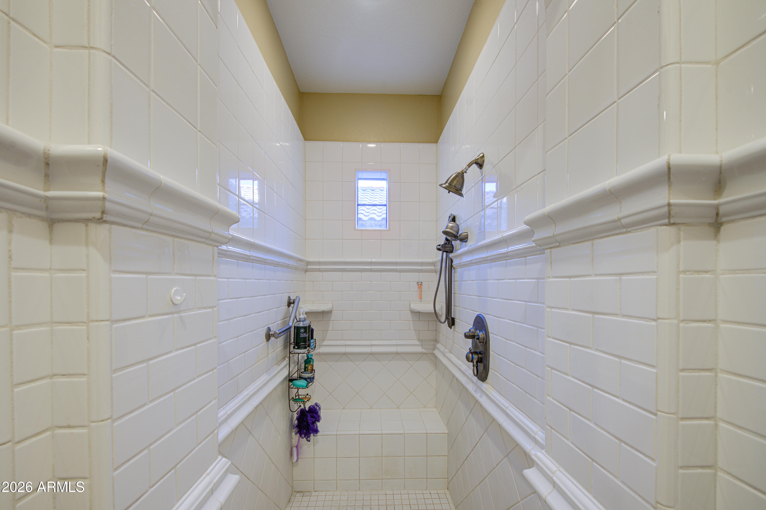14474 West Coronado Road Goodyear, AZ 85395 - Photo 37 of 74 a bathroom with a bathtub and shower