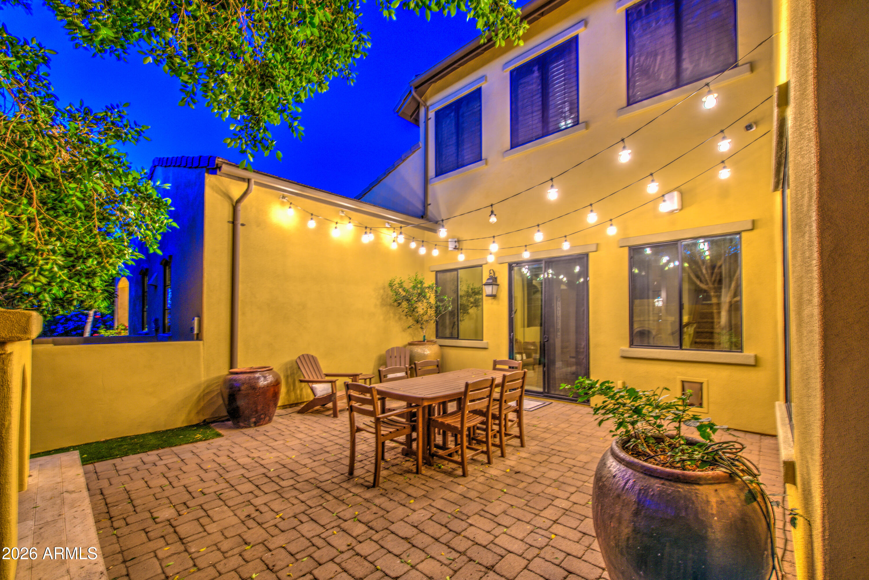 14474 West Coronado Road Goodyear, AZ 85395 - Photo 40 of 74 a view of a patio with a dining table and chairs