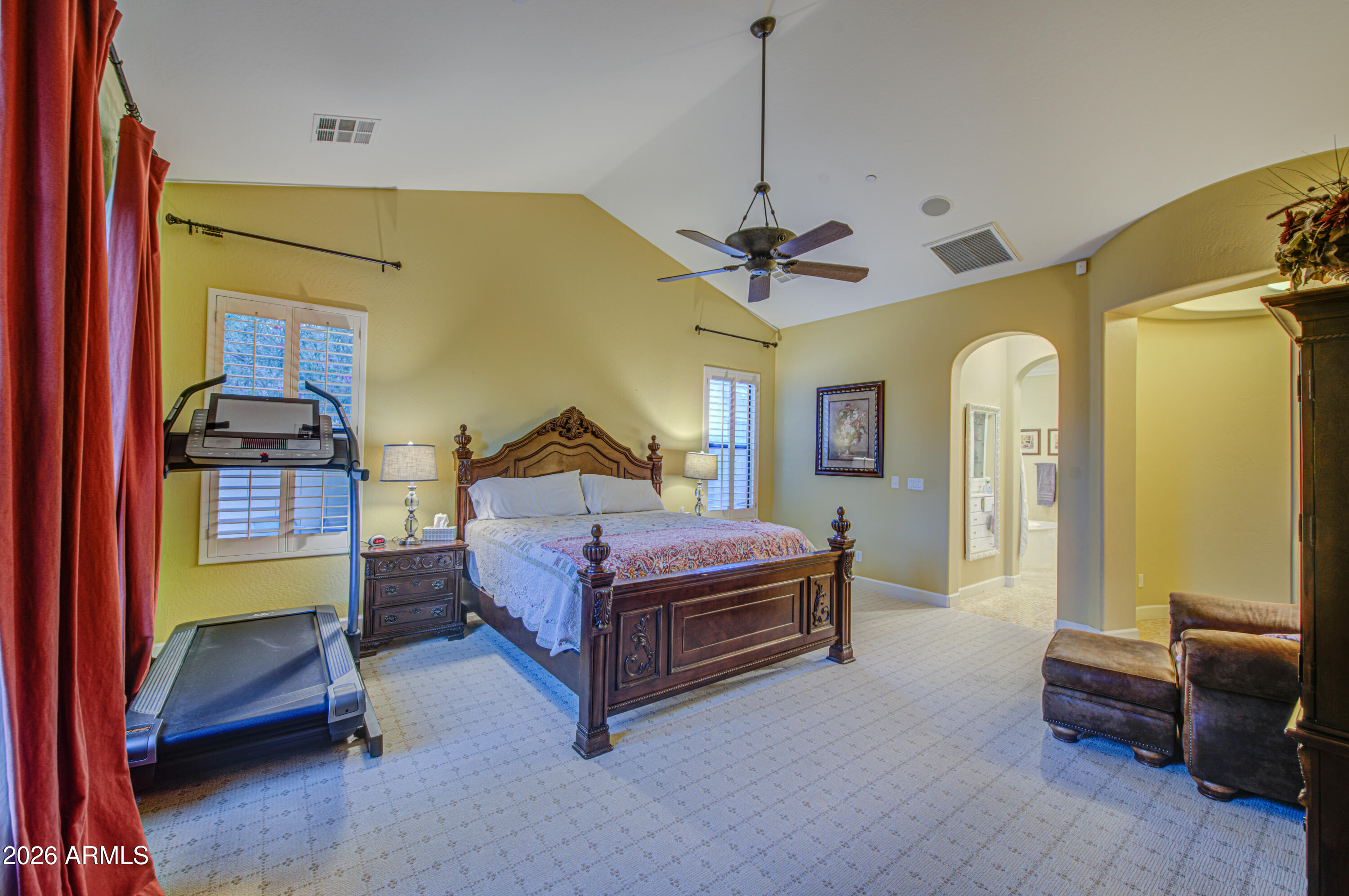 14474 West Coronado Road Goodyear, AZ 85395 - Photo 43 of 74 a bedroom with a bed and a chandelier