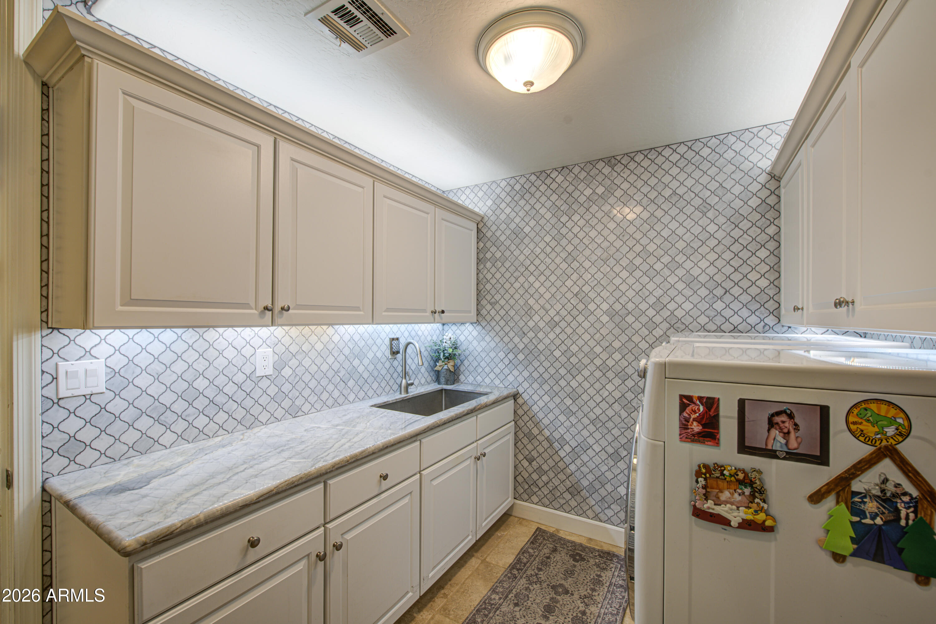 14474 West Coronado Road Goodyear, AZ 85395 - Photo 48 of 74 a bathroom with a sink and a mirror