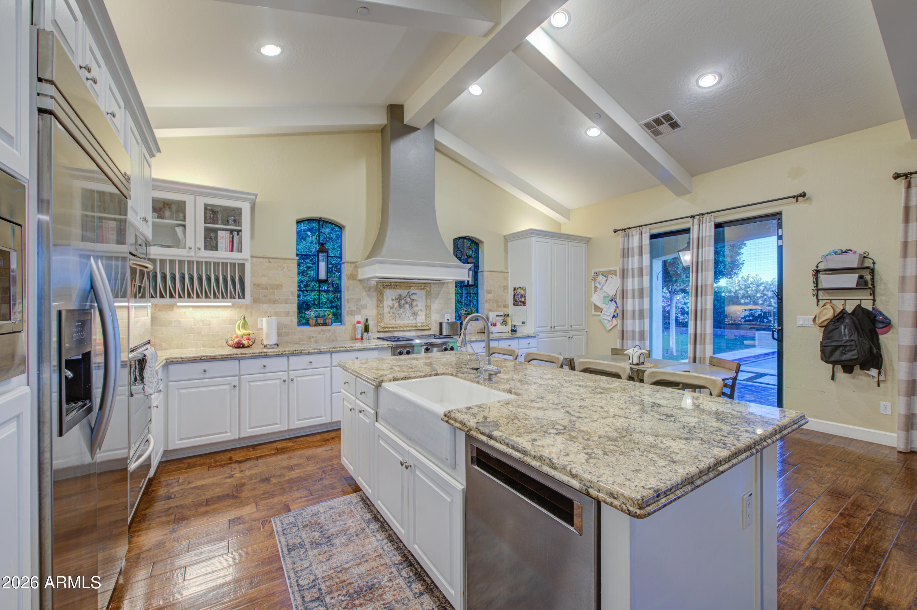 14474 West Coronado Road Goodyear, AZ 85395 - Photo 53 of 74 a kitchen with center island and stainless steel appliances