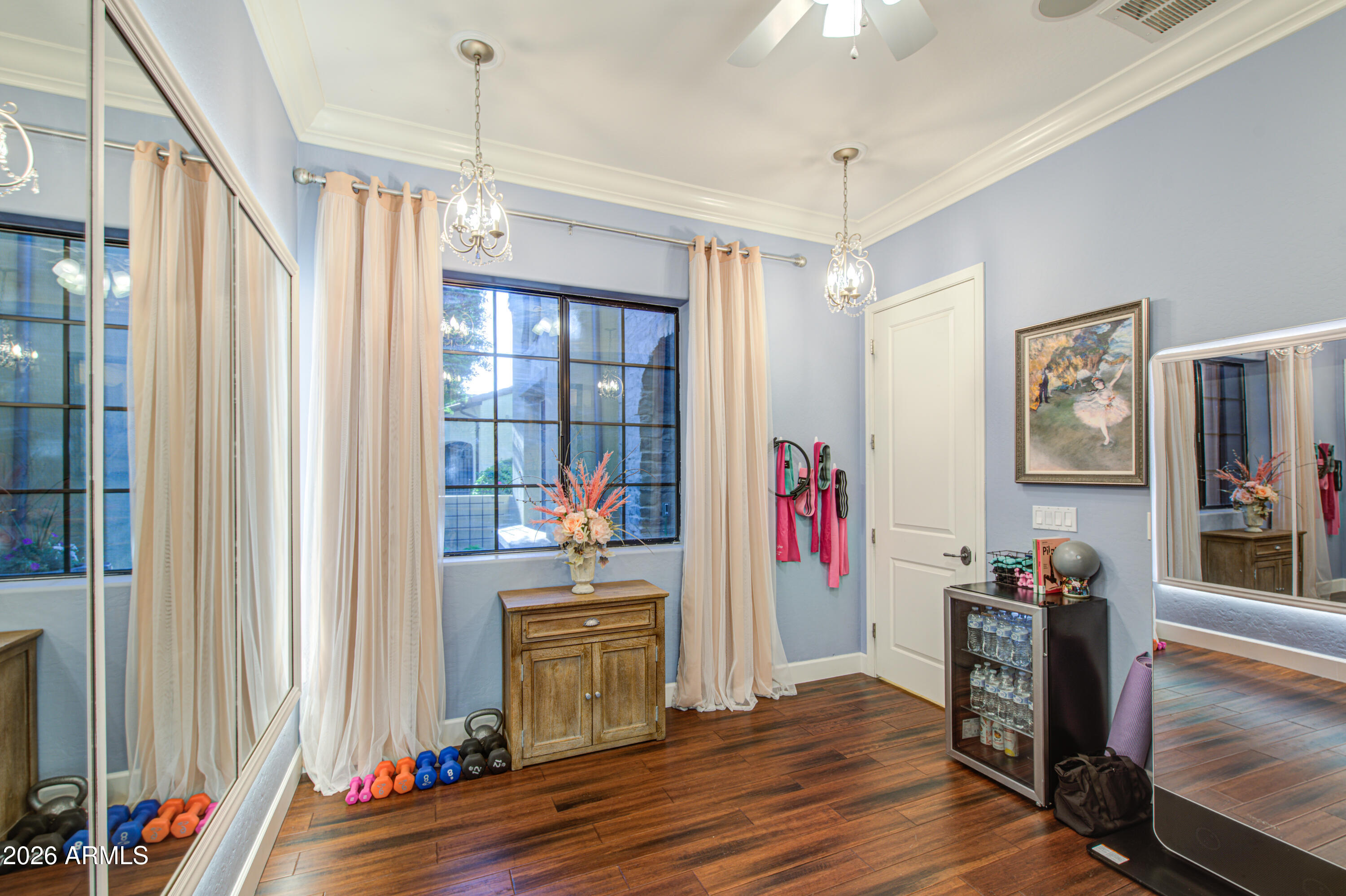 14474 West Coronado Road Goodyear, AZ 85395 - Photo 58 of 74 a living room with furniture and a flat screen tv