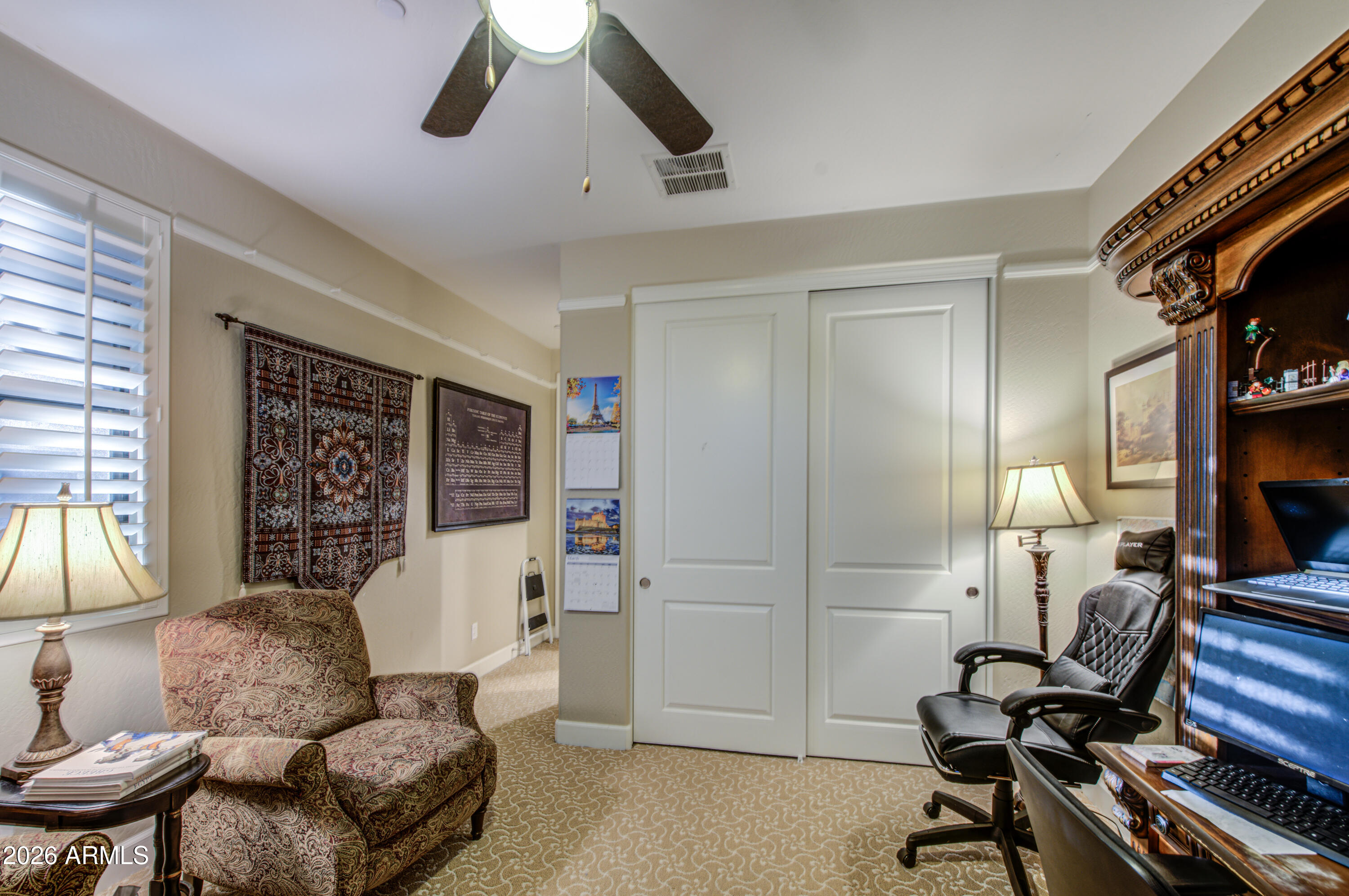14474 West Coronado Road Goodyear, AZ 85395 - Photo 59 of 74 a living room with furniture and a flat screen tv
