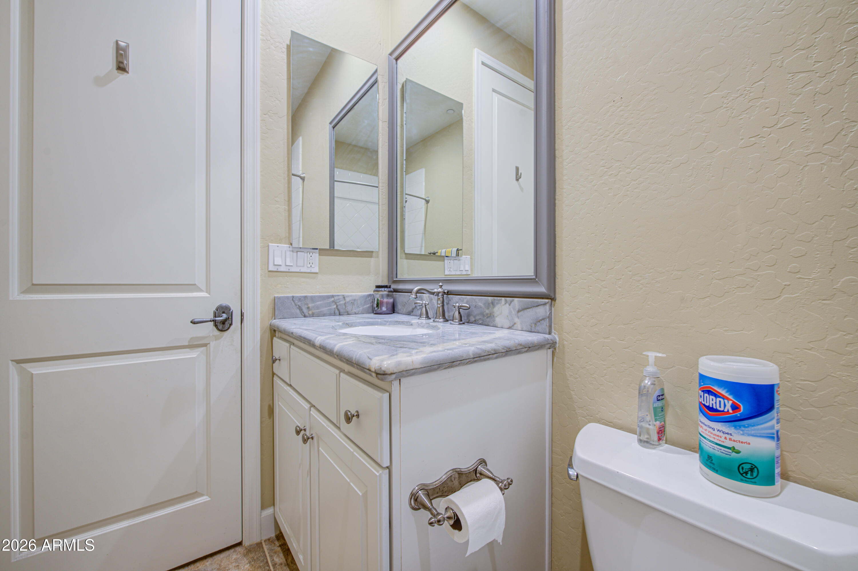 14474 West Coronado Road Goodyear, AZ 85395 - Photo 60 of 74 a bathroom with a granite countertop sink and a mirror