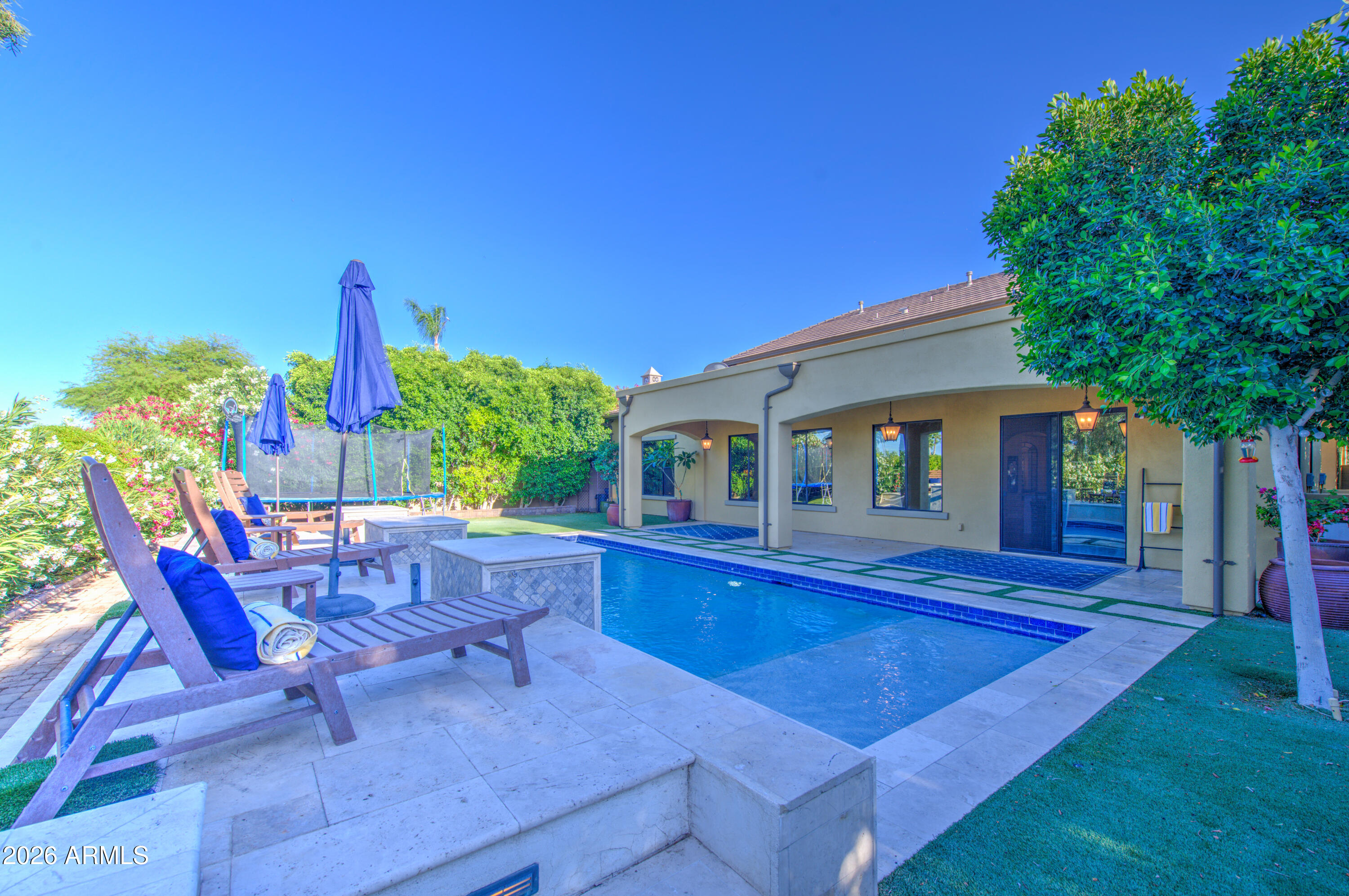 14474 West Coronado Road Goodyear, AZ 85395 - Photo 6 of 74 a view of a house with swimming pool and sitting area