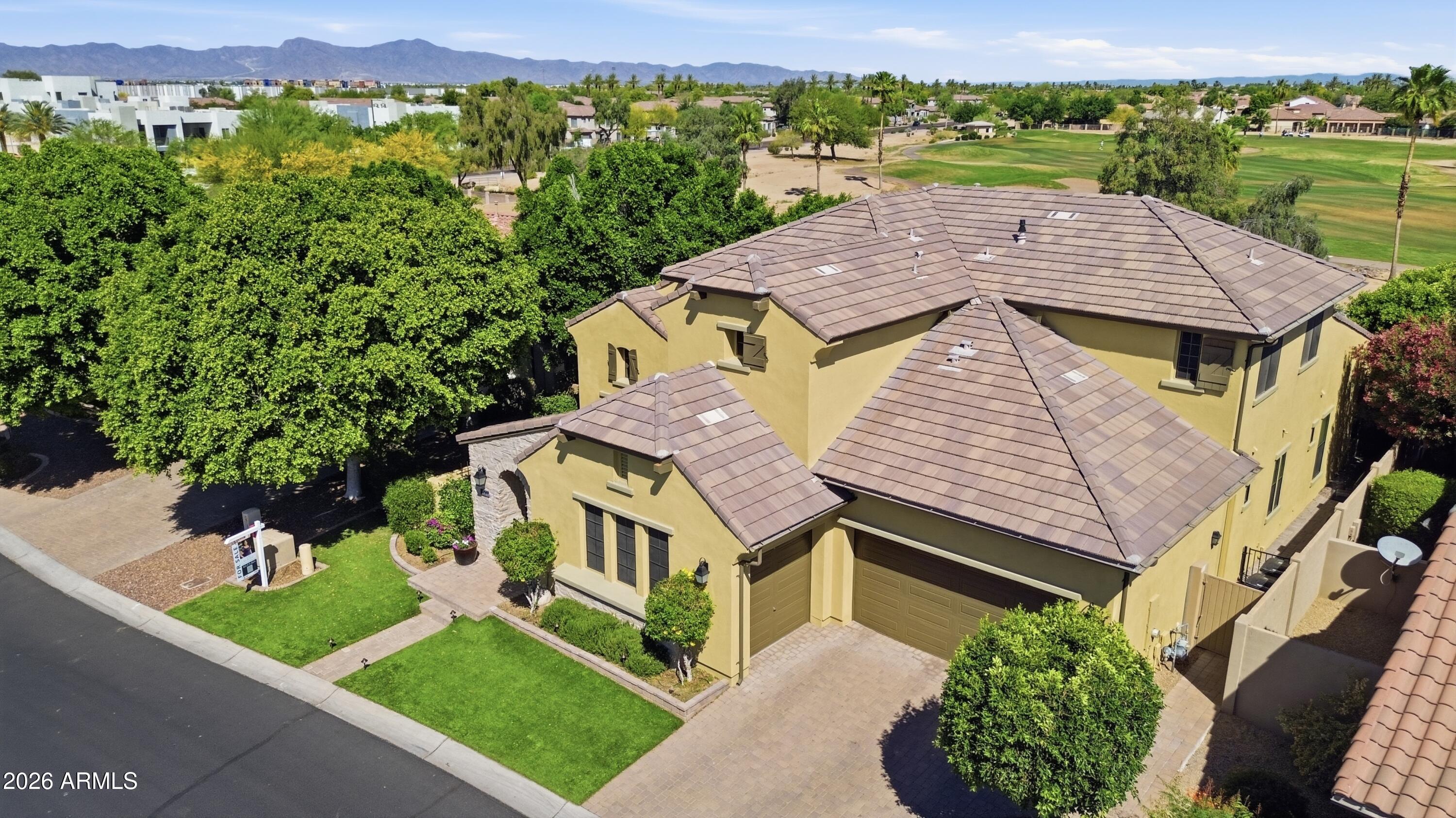 14474 West Coronado Road Goodyear, AZ 85395 - Photo 70 of 74 an aerial view of a house with a garden and lake view