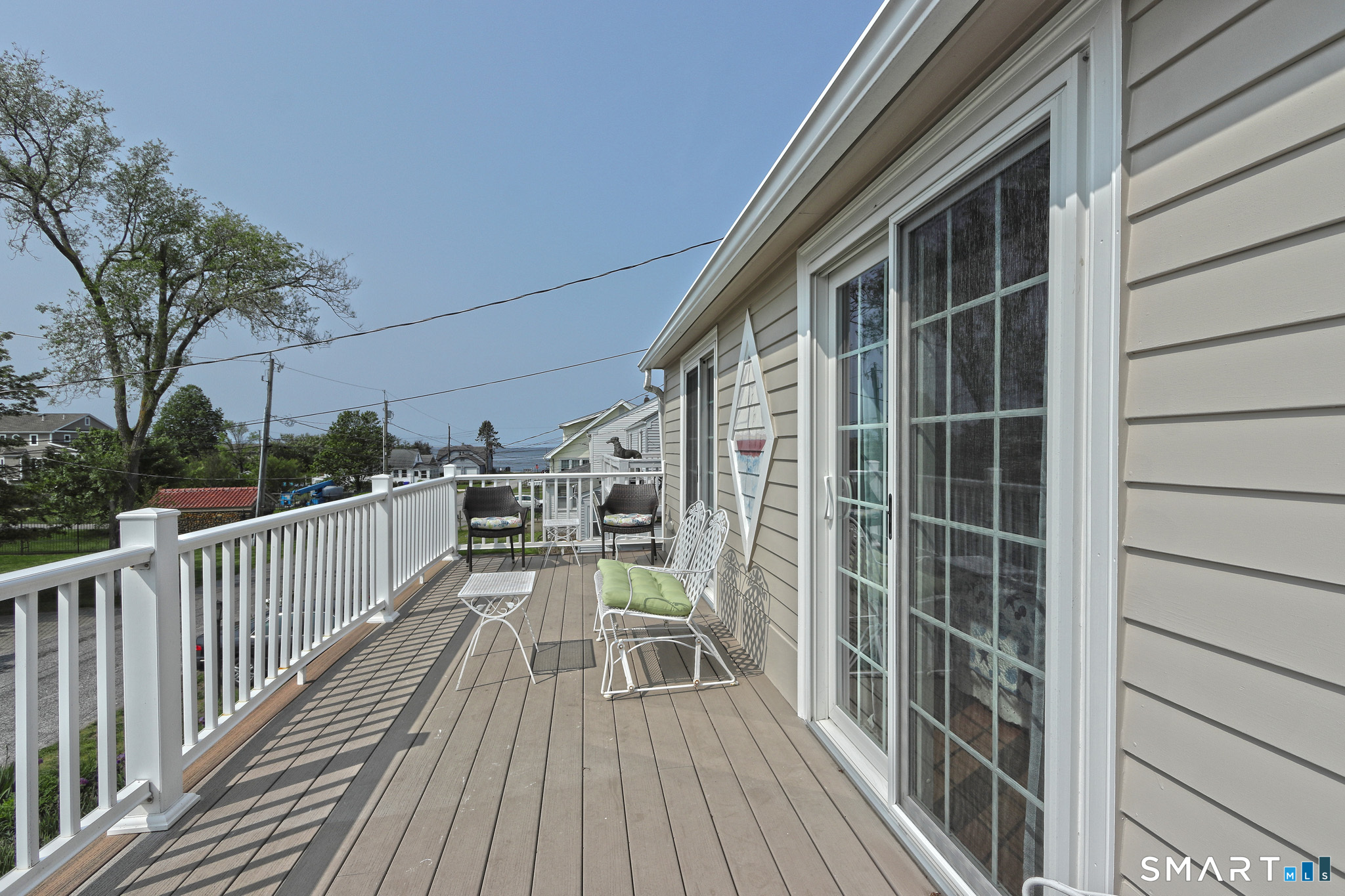 13 Billows Road Old Saybrook, CT 06475 - Photo 27 of 34 Upper deck with water view is perfect for evening cocktails. Also, a great spot for reading a book.
