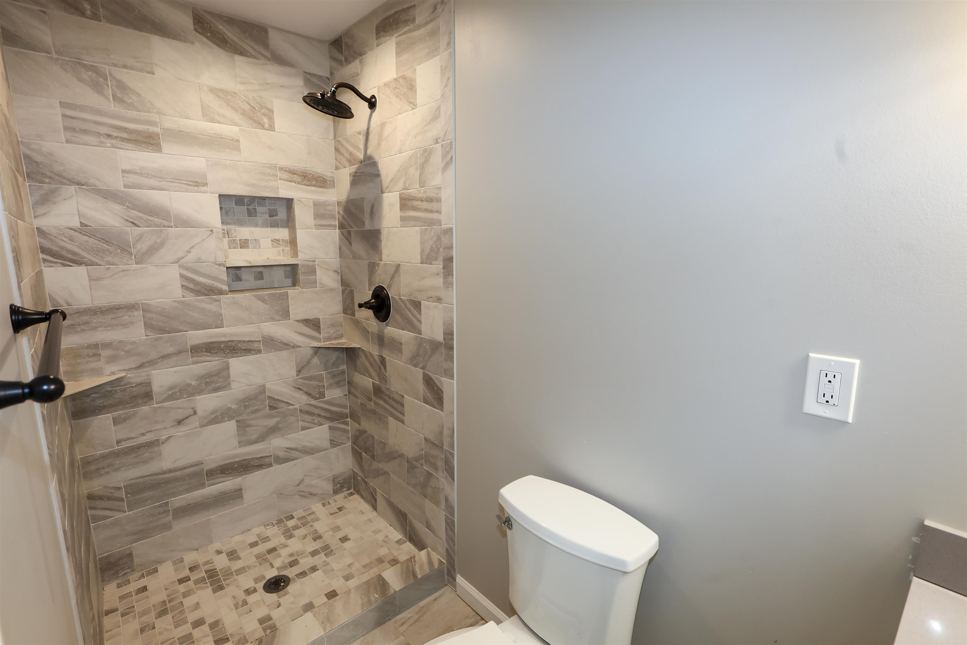 8074 Van Road Arlington, TN 38002 - Photo 23 of 24 a white toilet sitting next to a shower