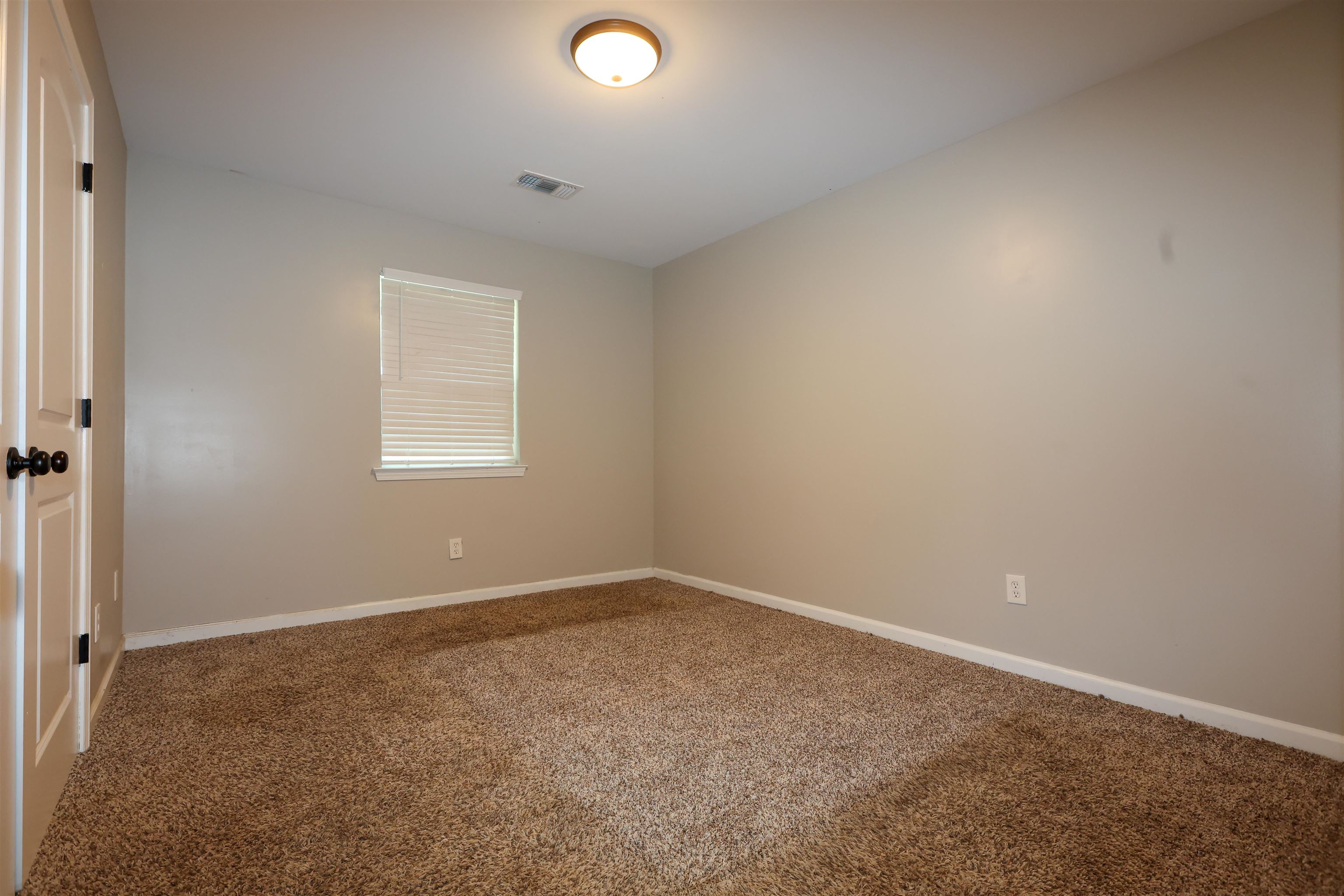 8074 Van Road Arlington, TN 38002 - Photo 4 of 24 an empty room with a window