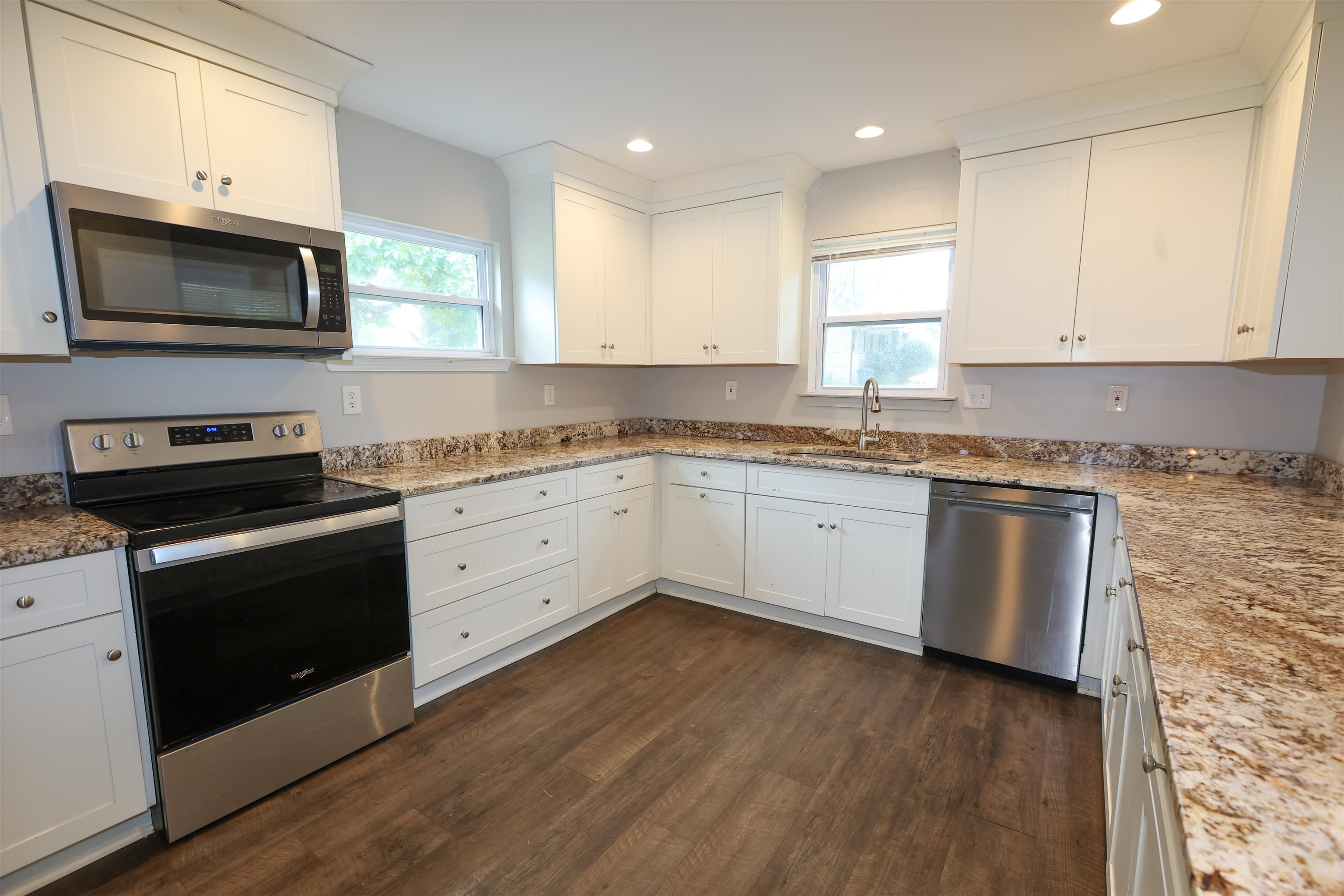 8074 Van Road Arlington, TN 38002 - Photo 5 of 24 a kitchen with granite countertop white cabinets and white appliances