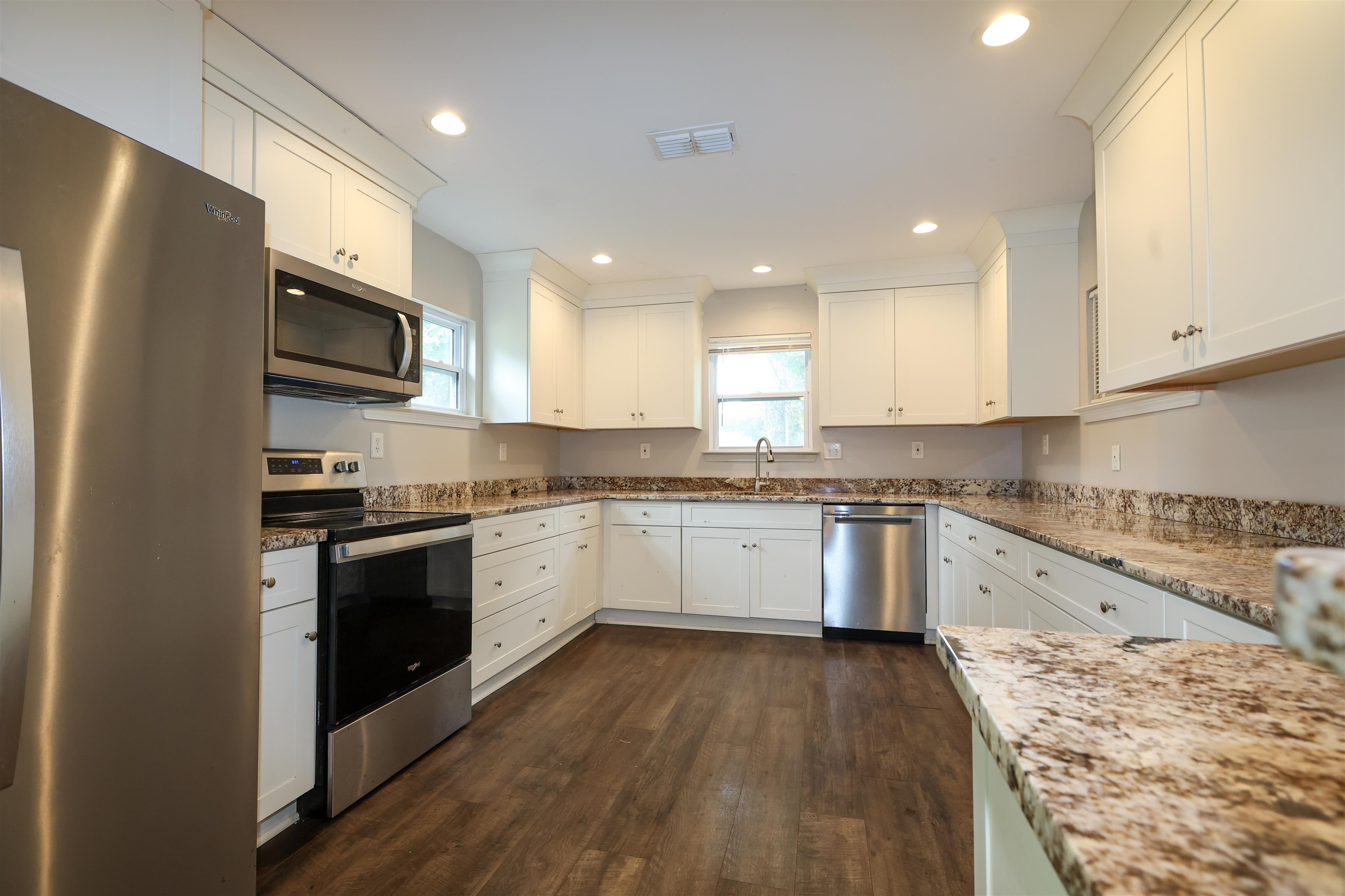 8074 Van Road Arlington, TN 38002 - Photo 8 of 24 a kitchen with granite countertop a refrigerator stove top oven and sink