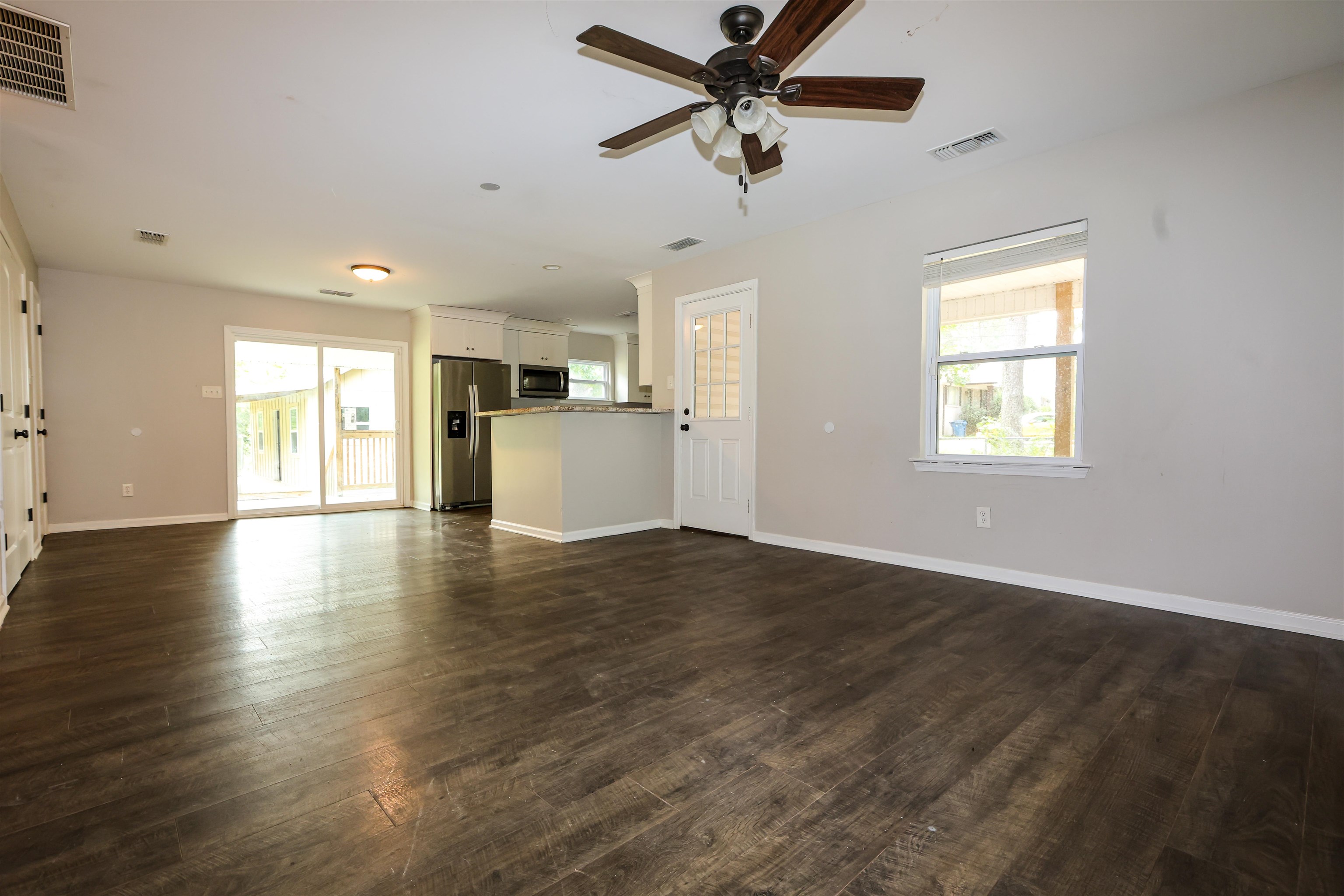 8074 Van Road Arlington, TN 38002 - Photo 10 of 24 a view of an empty room with window and wooden floor