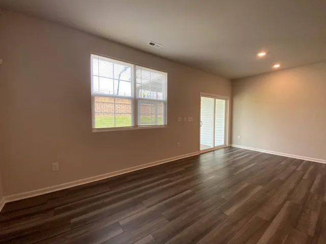 a view of kitchen with wooden floor