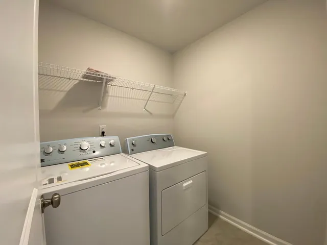 a bathroom with a shower sink and mirror