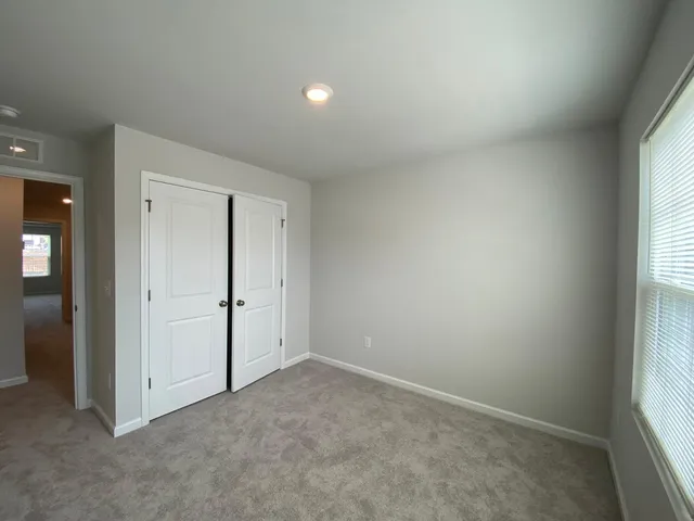 a view of swimming pool with a lounge chairs