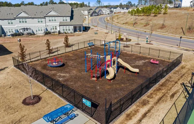 an aerial view of a house with a swimming pool