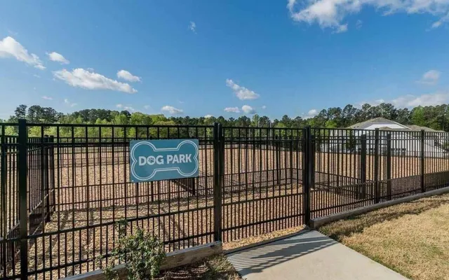 a room with pool table chairs and flat screen tv