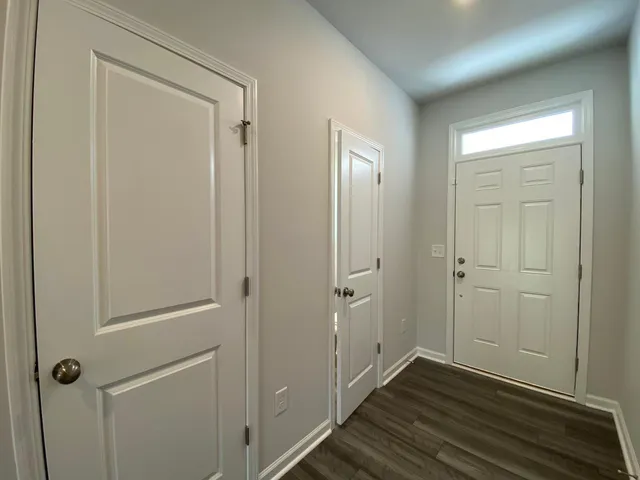 a kitchen with a refrigerator sink and stainless steel appliances