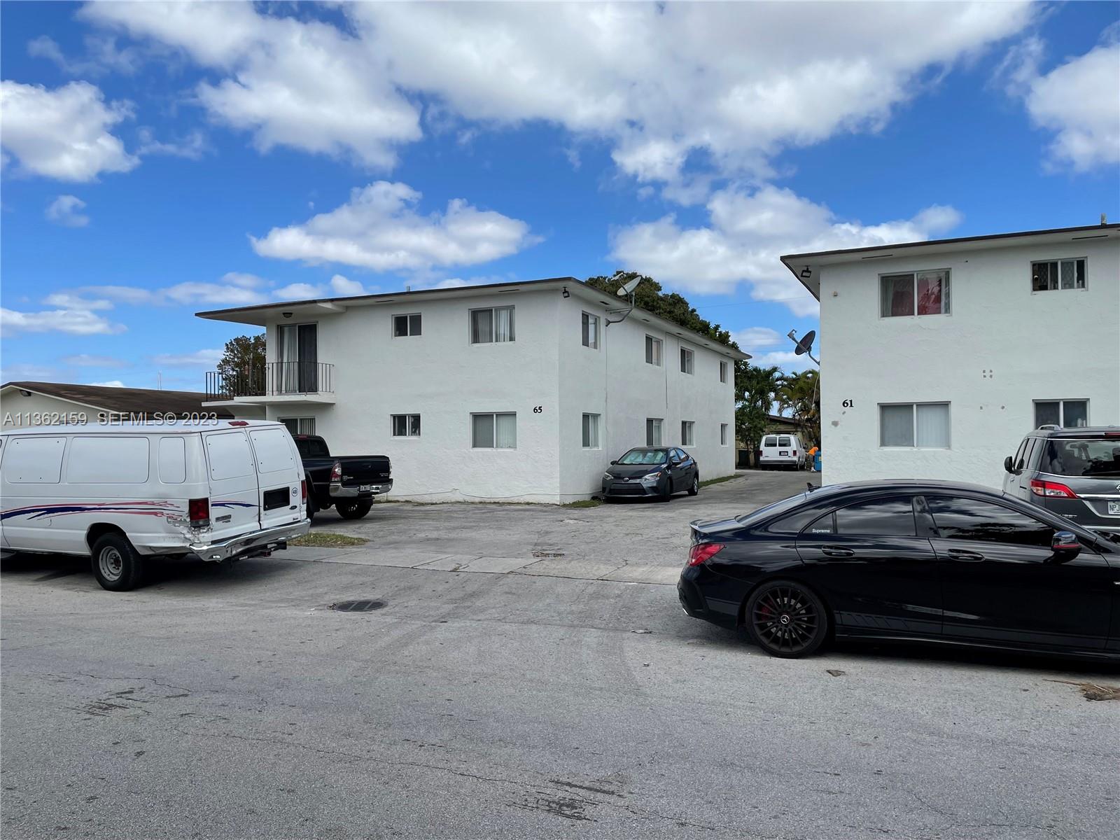 61 West 13th Street Hialeah, FL 33010 - Photo 3 of 3 a view of a cars parked in front of a house