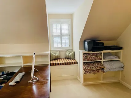 a bathroom with a tub sink and a window