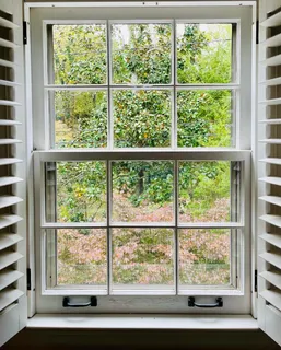 a view of a wooden door and outdoor seating