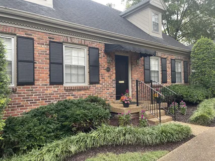 a front view of a house with a porch