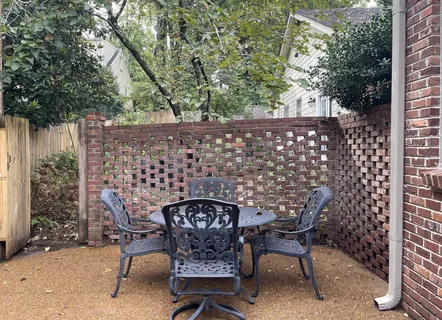 a patio with table and chairs