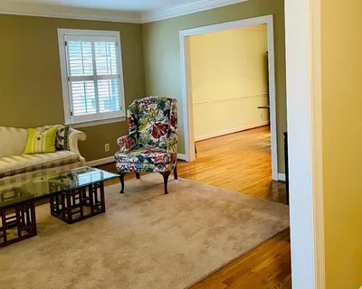 a living room with furniture and a window