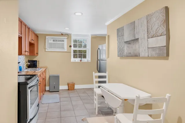 a kitchen with a stove a sink and a refrigerator