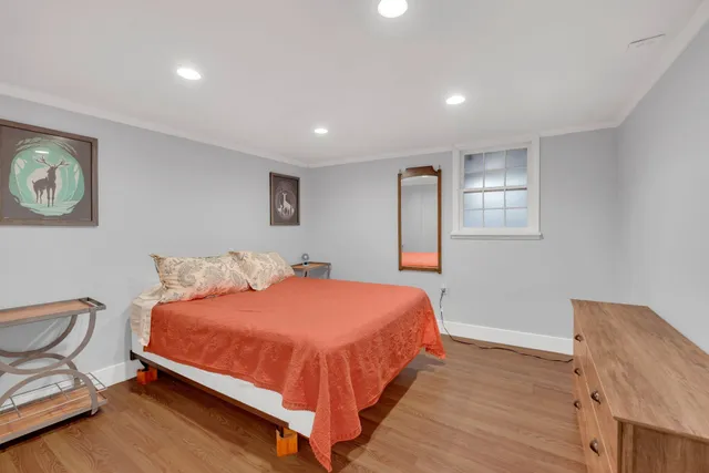 a bedroom with a bed and chair