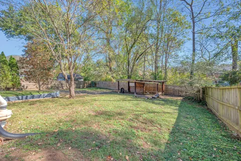 a backyard of a house with lots of green space
