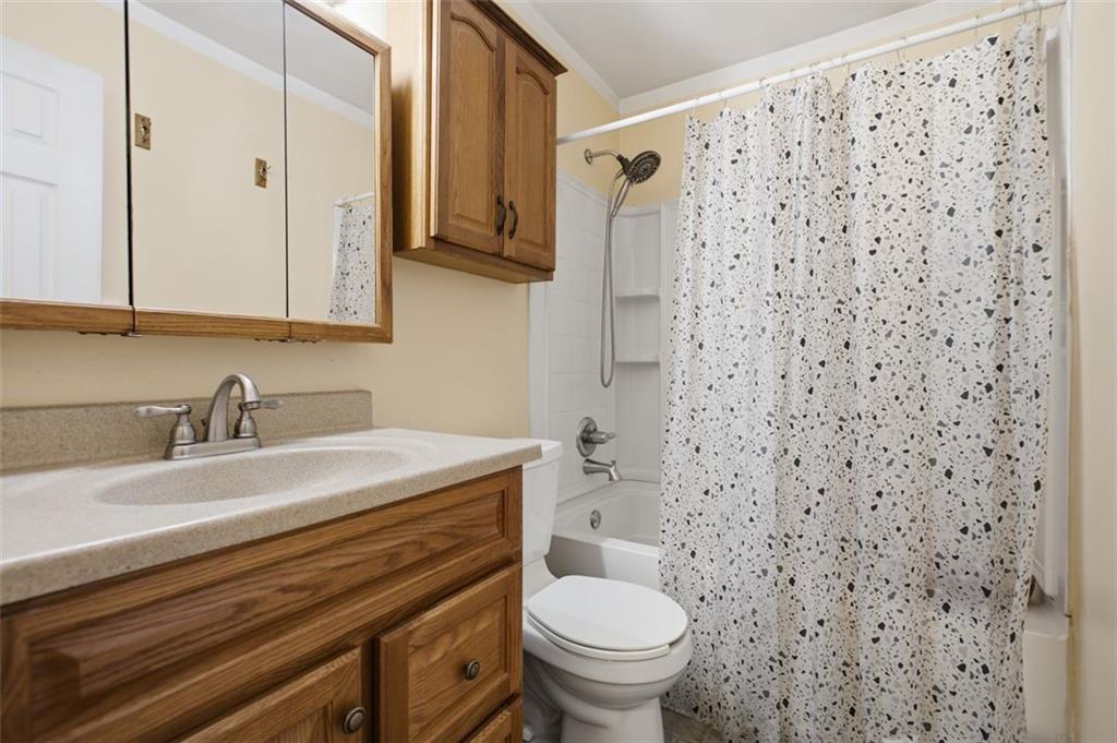 346 Burns Road Slippery Rock, PA 16057 - Photo 16 of 27 a bathroom with a granite countertop toilet sink and mirror