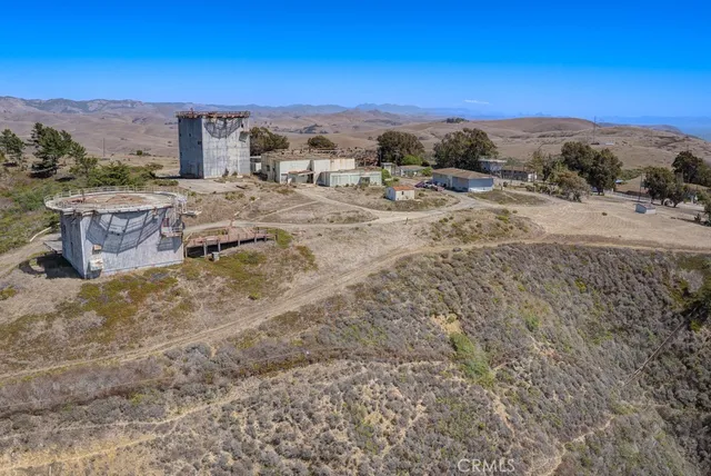 an aerial view of beach and building