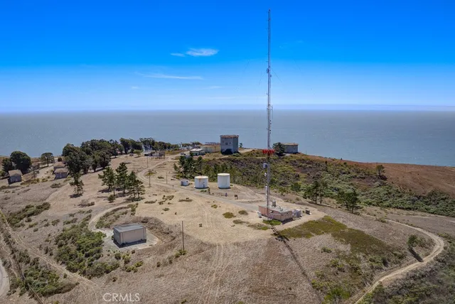 a view of a house with wooden fence