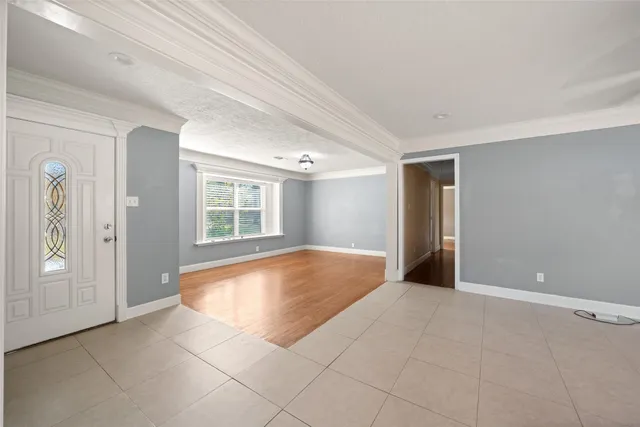 a kitchen with granite countertop a sink stainless steel appliances a counter space and a window