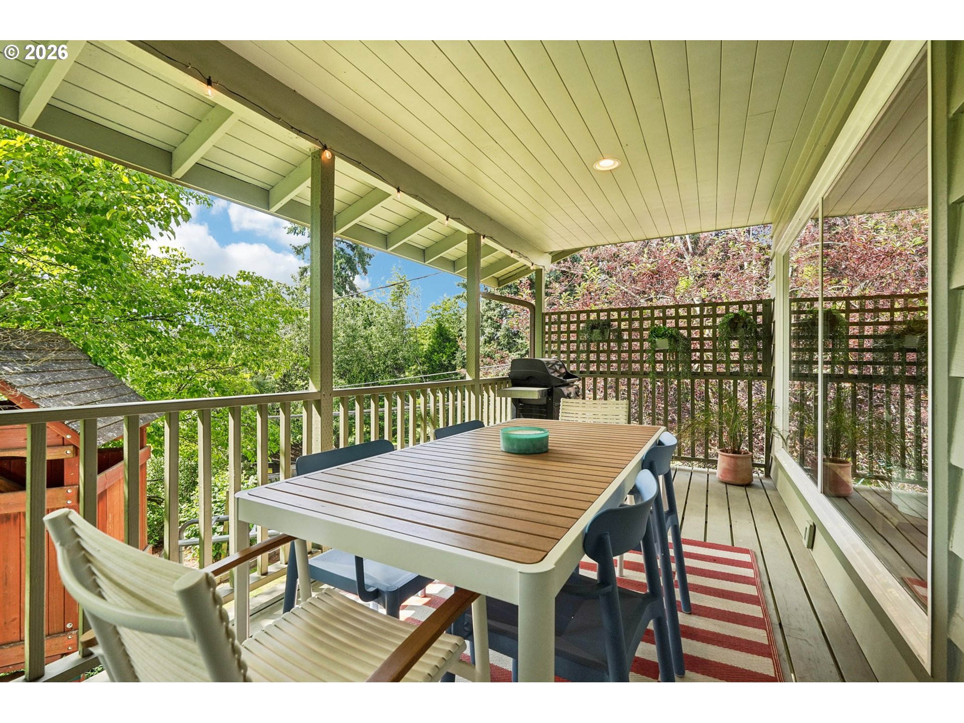 7225 Southwest 13th Avenue Portland, OR 97219 - Photo 40 of 48 a view of a wooden deck with furniture