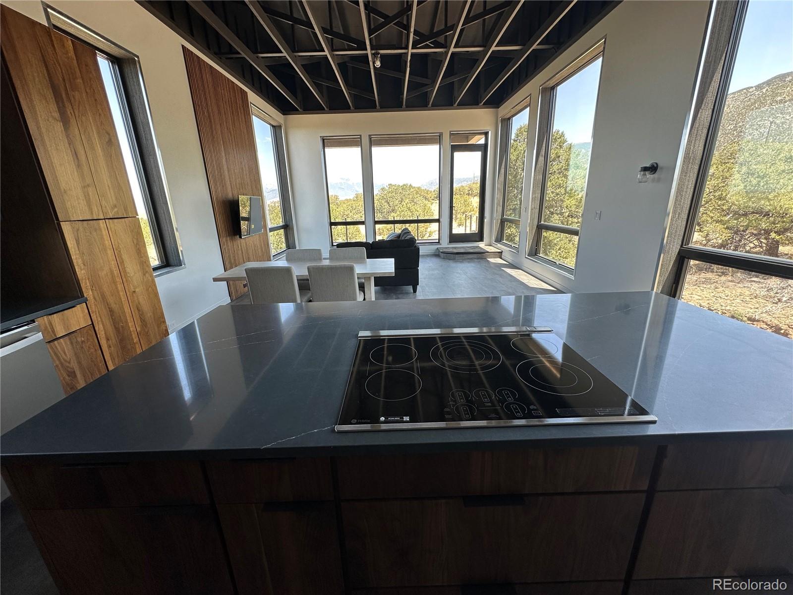 99 Cedar Ridge Road Mosca, CO 81146 - Photo 11 of 36 a living room with large window