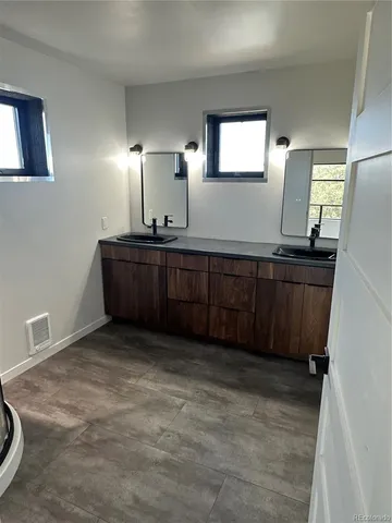 a view of a livingroom with furniture and window