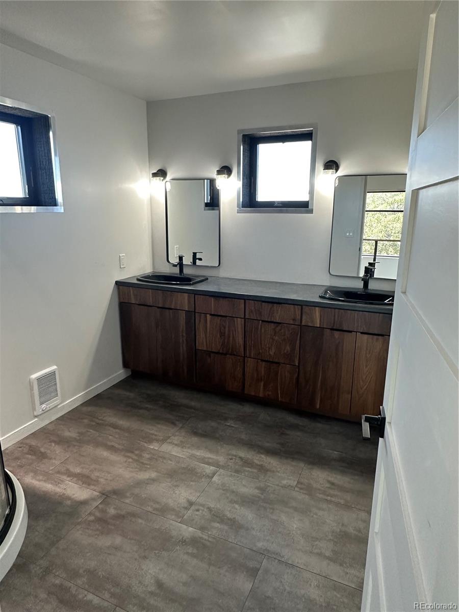 99 Cedar Ridge Road Mosca, CO 81146 - Photo 18 of 36 a bathroom with a sink and a mirror