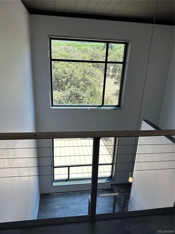 a view of hallway with windows