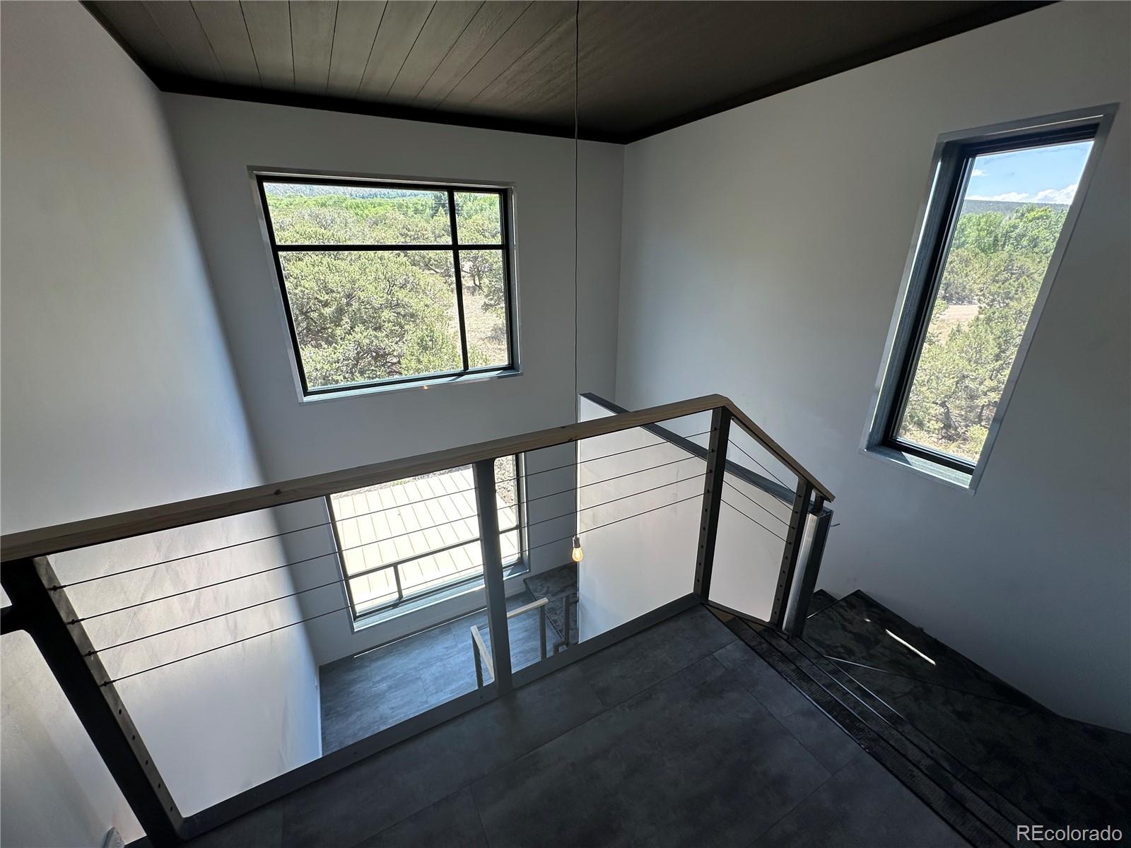 99 Cedar Ridge Road Mosca, CO 81146 - Photo 30 of 36 a view of hallway with windows