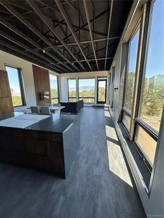 a kitchen with stainless steel appliances granite countertop a refrigerator a stove a sink dishwasher and cabinets with wooden floor