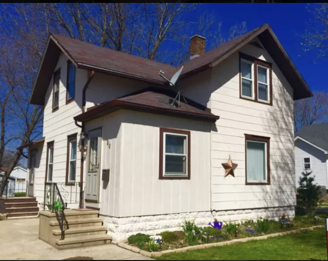 212 South 10th Street Rochelle, IL 61068 - Photo 1 of 15 a front view of a house with a yard