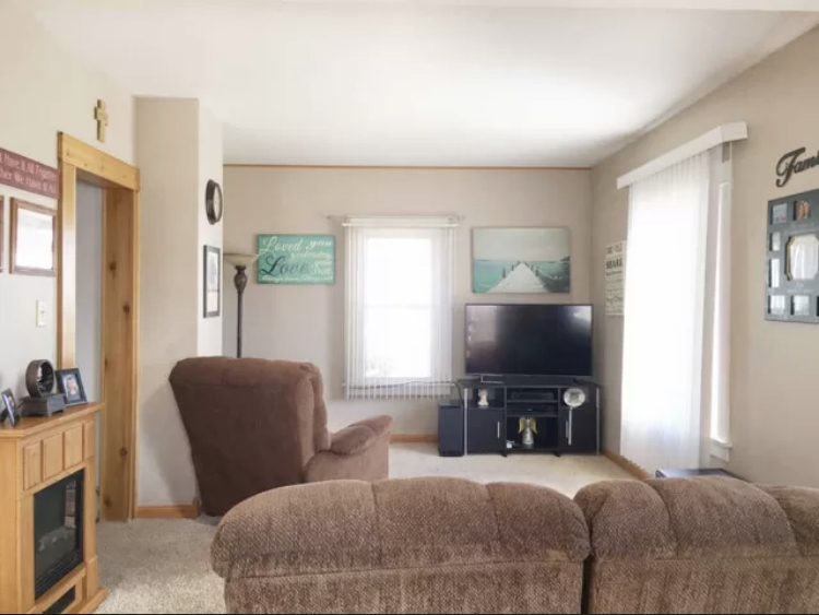 212 South 10th Street Rochelle, IL 61068 - Photo 2 of 15 a living room with furniture and a flat screen tv