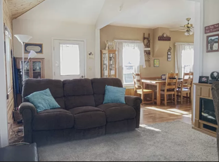212 South 10th Street Rochelle, IL 61068 - Photo 3 of 15 a living room with furniture a large window and a fireplace