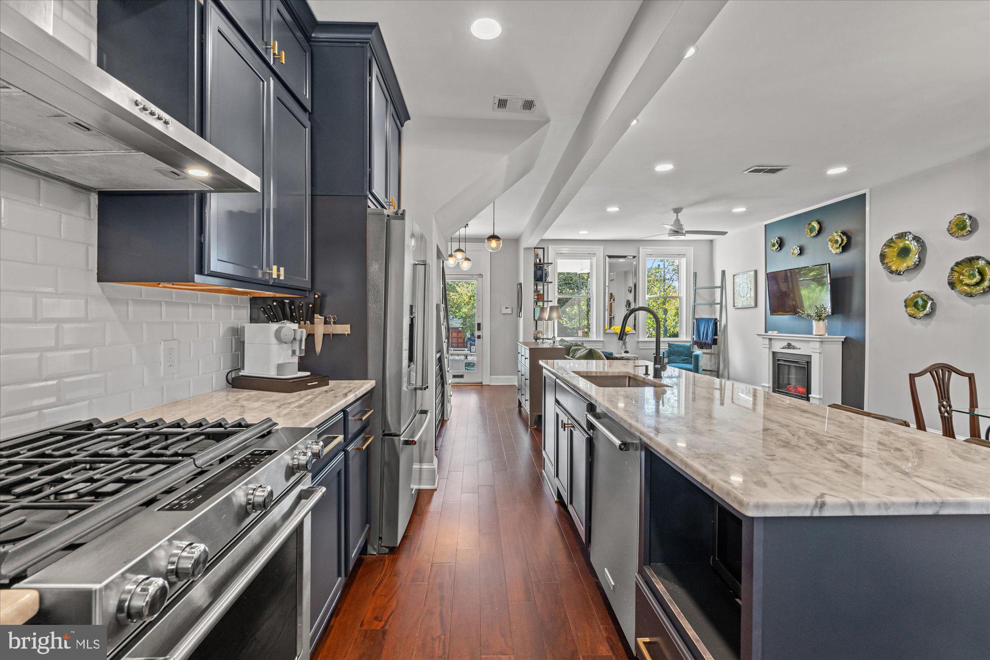 1204 5th Street Northeast Washington, DC 20002 - Photo 12 of 46 a kitchen with granite countertop a stove and a sink