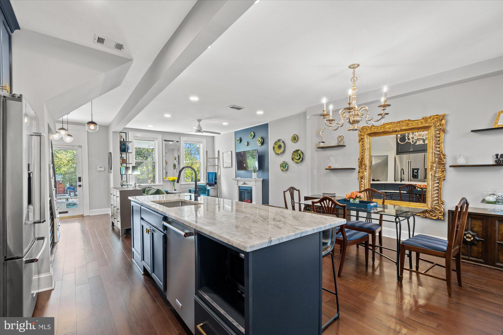 1204 5th Street Northeast Washington, DC 20002 - Photo 14 of 46 a large kitchen with lots of counter space and painting on the table