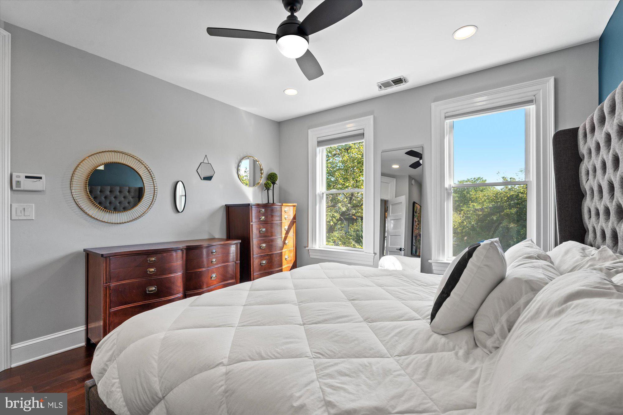 1204 5th Street Northeast Washington, DC 20002 - Photo 19 of 46 a bedroom with a bed mirror and window