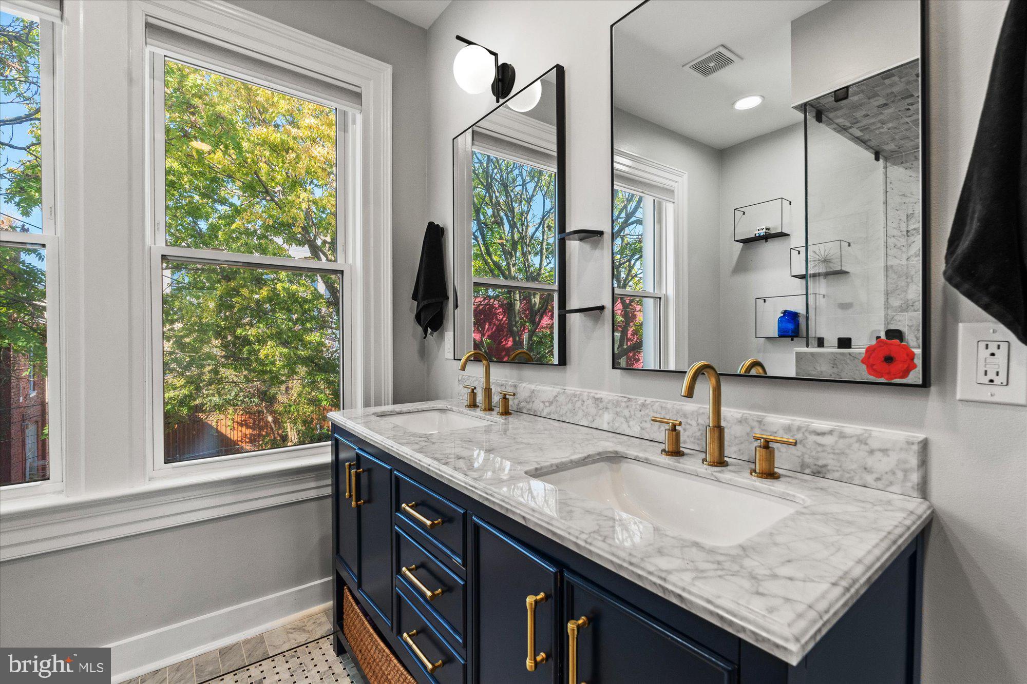 1204 5th Street Northeast Washington, DC 20002 - Photo 21 of 46 a bathroom with a granite countertop sink and a window